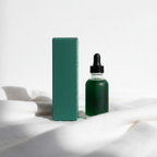Cocokind Chlorophyll Discoloration Serum package shown from a turned-away angle on white linen