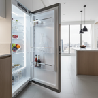 Modern kitchen setting showing a contoured crystal wine carafe resting neatly inside a refrigerator door shelf next to fresh fruits