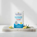 Minimalistic bright lifestyle photo displaying cardiovascular supplement box on natural stone surface