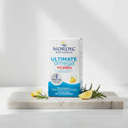 Minimalistic bright lifestyle photo displaying cardiovascular supplement box on natural stone surface