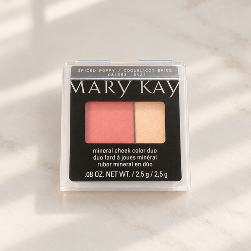 Mary Kay Mineral Cheek Color Duo Spiced Poppy compact on a softly lit vanity