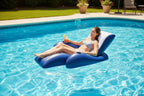 Intex Floating Recliner Lounge person relaxing in backyard pool sunny afternoon cold drink in cup holder