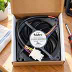 GE WR60X10358 condenser fan in its open box on a maintenance desk