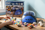 Maxx Explore Rock Tumbler blue machine on wooden desk with colorful polished gemstones and rough rocks