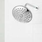 Close-up of Pfister Arterra polished chrome shower head with water spraying from multiple nozzles.