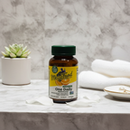 MegaFood Women's 40+ One Daily multivitamin amber glass bottle on white marble vanity with soft morning light – More4less Outlet
