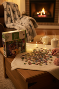 MasterPieces Peter Pan 1000-piece jigsaw puzzle box on cozy living room table with puzzle pieces spread out — More4less Outlet