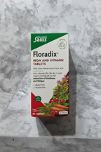 Salus Floradix Iron and Vitamin Tablets 84ct box on marble with vegan and gluten-free logos prominent