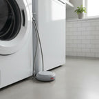 Roost Protection360 water sensor placed next to washing machine water intake lines in laundry room