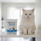 VetClassics Tear Stain soft chews tub on a white shelf next to a fluffy white Persian cat with clean bright eyes