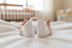 Gerber Baby Wiggle Proof Stay On white socks on baby's feet in cozy nursery – More4less Outlet