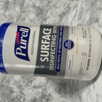 Macro close-up of Purell Professional Wipes label showing Kills 99.9% of Bacteria and Viruses and No Harsh Chemicals