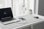 Belkin BOOST↑CHARGE 68W GaN wall charger white plugged in charging MacBook Pro and iPhone simultaneously on clean desk — More4less Outlet