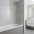 Water streaming naturally from a silver showerhead extending from a polished chrome Hansgrohe shower arm