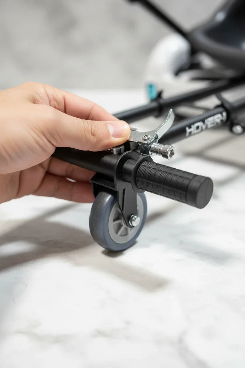 In-hand macro close-up of Hover-1 Buggy adjustable frame hardware and 360-degree caster wheel detail