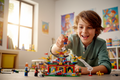 Young boy pressing down on LEGO NINJAGO Kai minifigure performing backflip on Dragon Power Flip set – More4less Outlet