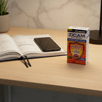 Zicam Cold Remedy Plus Elderberry box on home office desk with open premium planner and black smartphone