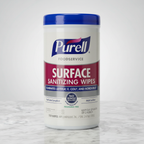 Front-facing studio shot of Purell Foodservice Surface Sanitizing Wipes canister on white marble countertop