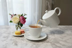Bernardaud Organza teacup French afternoon tea setting with macarons lifestyle