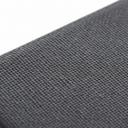 Macro close-up of slim dark grey Amazon Fire HD 10 case showing fine woven fabric texture and durable material quality