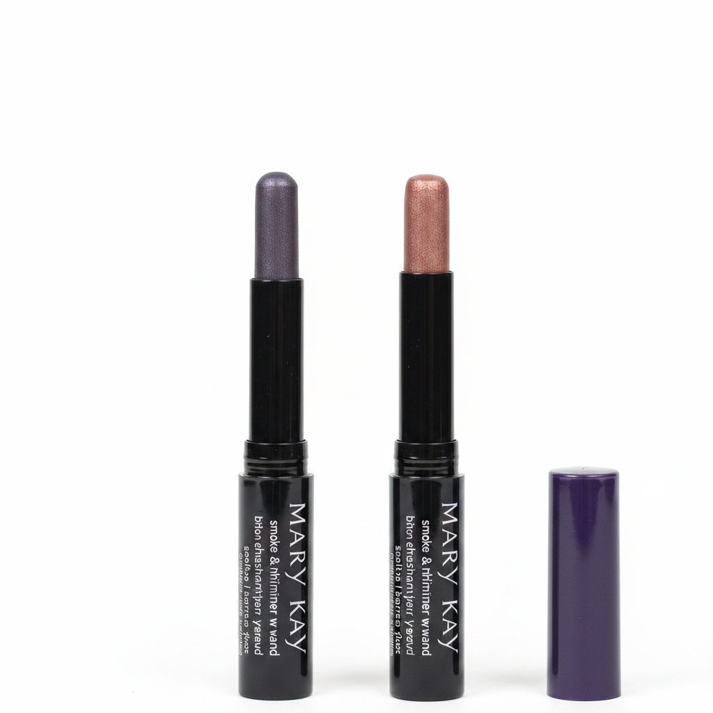 Close-up macro of two Mary Kay Smoke & Shimmer Eye Wands side by side — Amethyst Smoke with metallic slate-purple tip and Enchanted Mauve with shimmering rose-gold mauve tip, both with glossy black barrels and dark purple caps on white background
