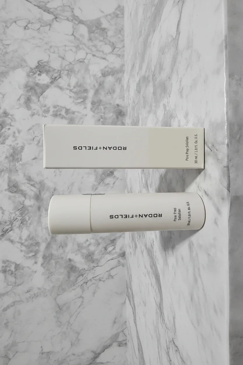 Rodan + Fields Pore Prep Solution modern professional skincare aesthetic with clean white packaging and bright stone background