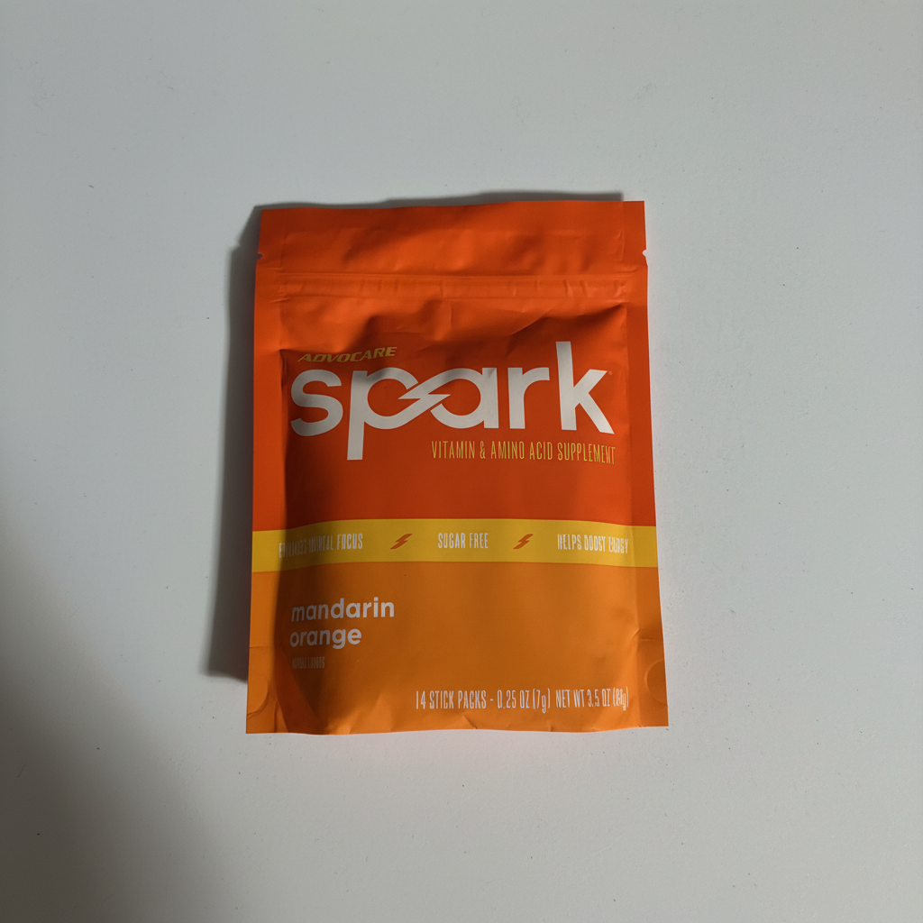 AdvoCare Spark Mandarin Orange supplement package on a neutral surface