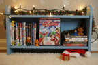 A Classic Christmas DVD on kids movie shelf with holiday and animated family DVDs and Christmas decorations – More4less Outlet