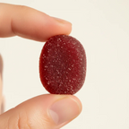 Close-up of deep red goji berry gummy supplement natural berry texture macro focus