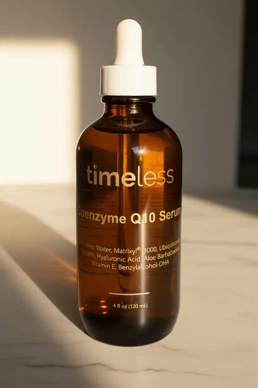 Large dark amber glass skincare dropper bottle sitting in warm morning sunlight on white marble
