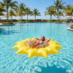 PoolCandy Sunflower Inflatable Pool Island floating in tropical resort pool palm trees blue sky