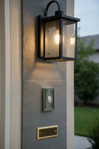 Baldwin Contemporary Doorbell Button Chrome on designer slate entry-wall next to outdoor porch lantern