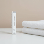 Rodan + Fields Brow Defining Boost Light 3 mL package in a neutral beauty setting