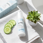 Yes To Intense Hydration Moisturizer flatlay on white linen with fresh cucumber slices and succulent.