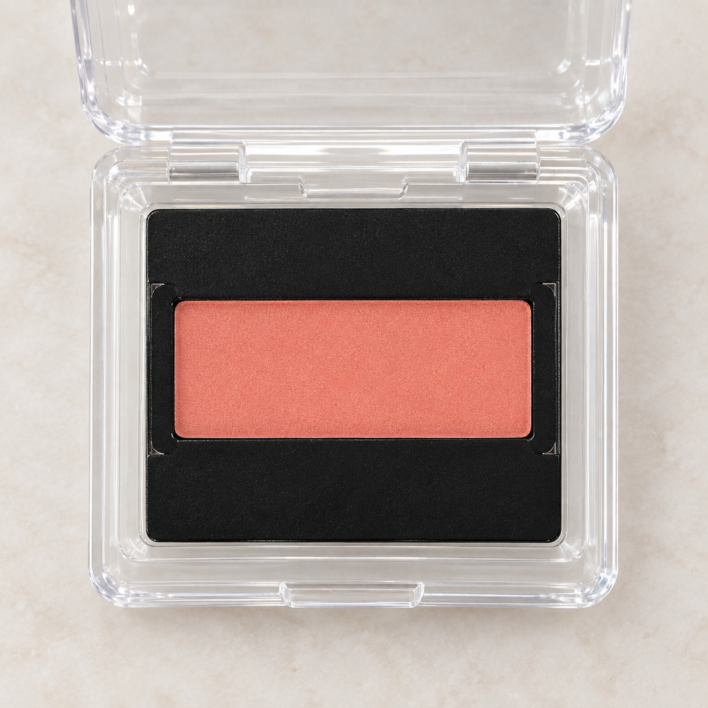 Close detail of Coral Sunrise Mary Kay Mineral Cheek Color refill pan in clear protective clamshell
