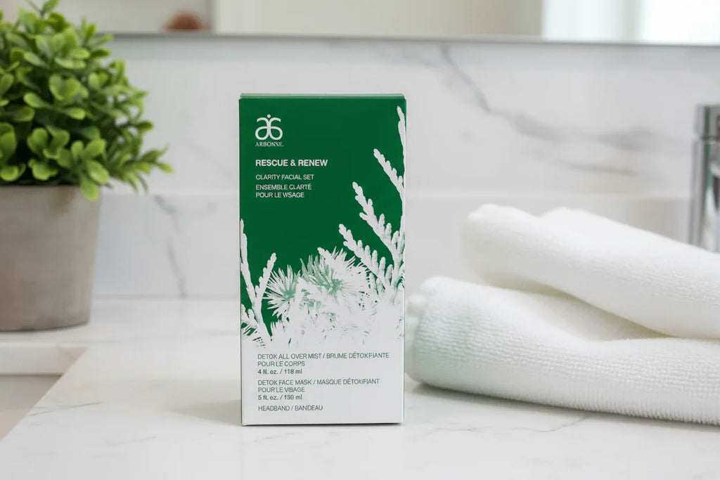 Arbonne Rescue and Renew Clarity Facial Set on marble bathroom counter spa lifestyle