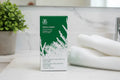 Arbonne Rescue and Renew Clarity Facial Set on marble bathroom counter spa lifestyle