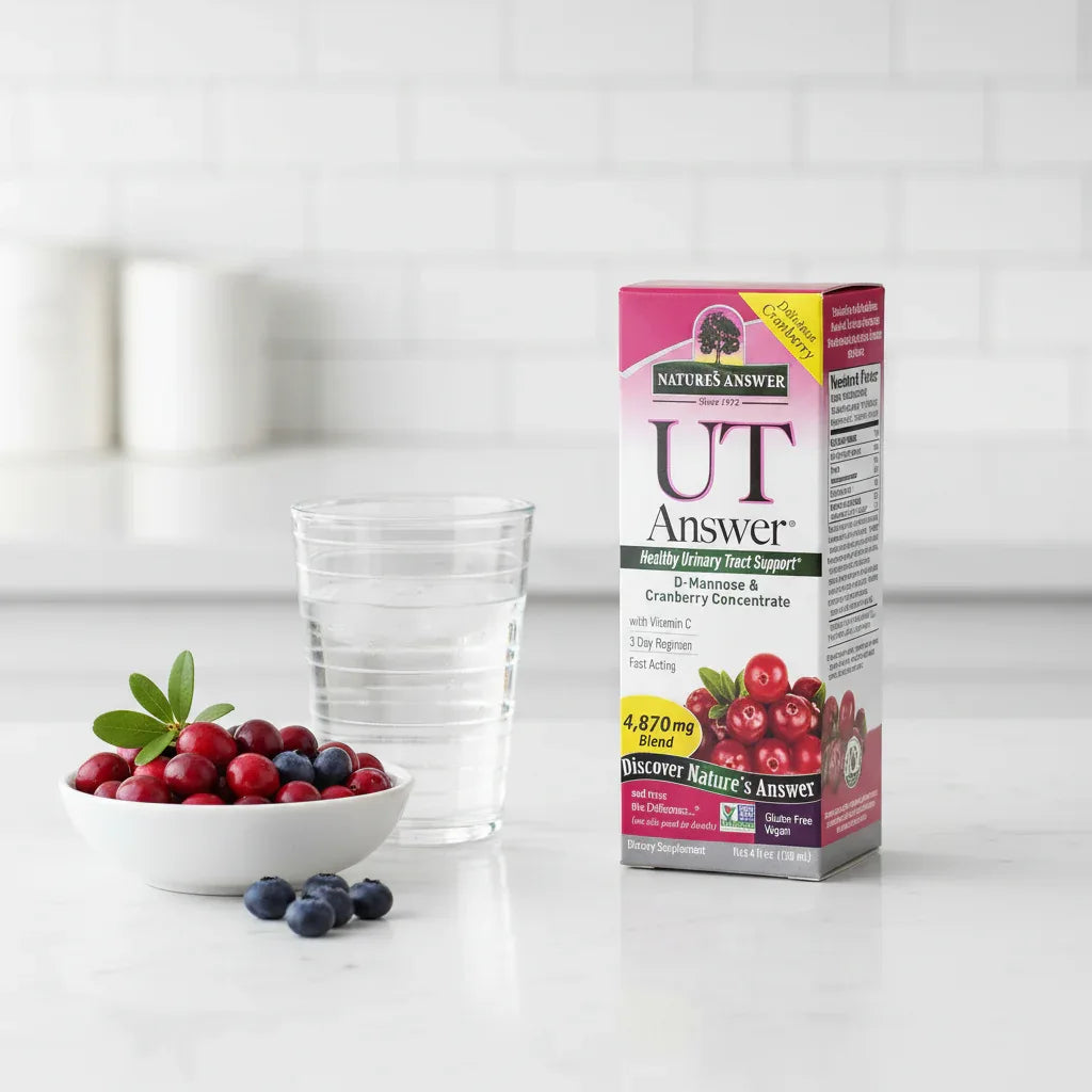Nature's Answer UT Answer D-Mannose Cranberry box on white quartz kitchen island with glass of water and bowl of organic berries