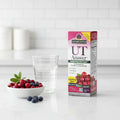 Nature's Answer UT Answer D-Mannose Cranberry box on white quartz kitchen island with glass of water and bowl of organic berries