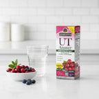 Nature's Answer UT Answer D-Mannose Cranberry box on white quartz kitchen island with glass of water and bowl of organic berries