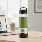 Magic Bullet Portable Blender on clean office desk with laptop and succulent plant showing green smoothie for workplace wellness