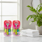 Gillette Venus Tropical Disposable Razors 6ct Bundle on quartz vanity with white towels and green houseplant