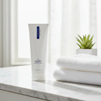ZO Medical Oilacleanse cleanser on white marble bathroom vanity with soft morning sunlight spa aesthetic