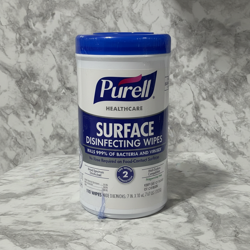 Studio product photograph of Purell Healthcare Surface Disinfecting Wipes canister on grey marble background
