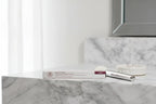 Arbonne Matte and Shine Lip Duo Bloom on marble makeup vanity with natural daylight lifestyle