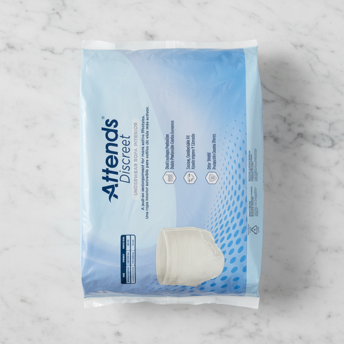 Front-facing studio shot of light blue Attends Discreet Men's Underwear L/XL packaging on clean marble surface