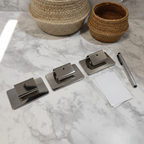 Whitmor silver label clips set of 3 flat lay on white marble with woven baskets and pen