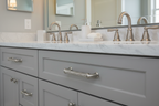 Baldwin Couture cabinet pull satin nickel on gray bathroom vanity with marble countertop and brushed nickel faucet - More4less Outlet
