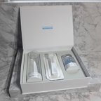 Rodan and Fields REDEFINE AMP MD System open white luxury box with derma-roller serum capsule container and cleansing vial on white marble vanity – More4less Outlet