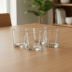 Four empty clear Anchor Hocking Mercado 7.5 fl oz glasses grouped on a neutral dining table